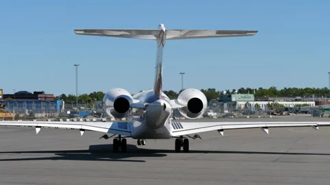 A Big Private Jet Aircraft Testing the Thrust Reverser on the Engine. Stock Footage 135996396
