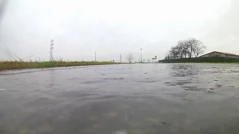 A big puddle and a car Stock Footage 69138043
