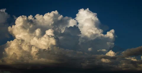 Big, Puffy Sunset Cloud (6k 25fps) Stock Footage 136636668