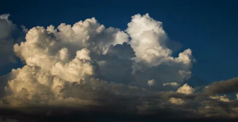 Big, Puffy Sunset Cloud (6k 23.976) Stock Footage 136636679