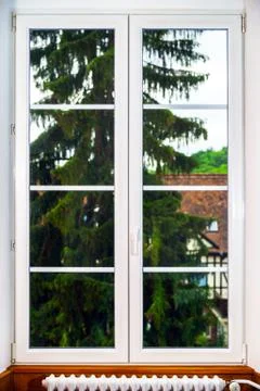Big pvc window with decoration elements in old french house Stock Photos