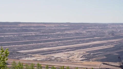 Big quarry with heavy machinery mining lignite coal in open pit min Stock Footage 332512518