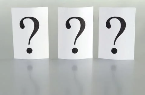 Big question mark on a piece of paper on a gray background Stock-Fotos