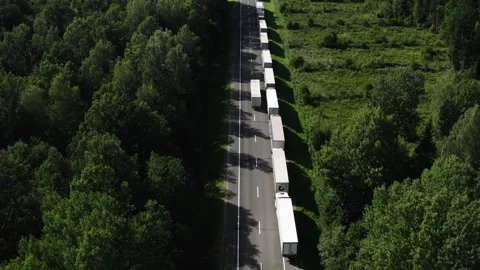 Big queue of trucks. Trucks wait in line for border crossing control. Stock Footage 289864809