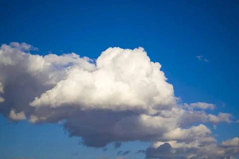 Big rain cloud in the sky during a spring day that will soon bring rain Stock Photos
