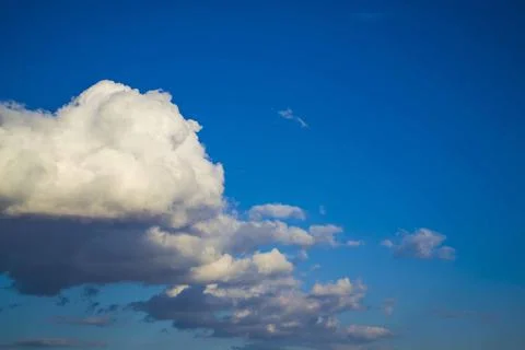 Big rain cloud in the sky during a spring day that will soon bring rain Stock Photos