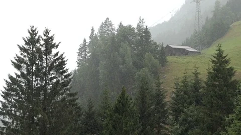 Big rain drops falling down in alpine landscape Video stock 119314918
