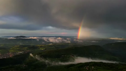 Big rainbow in sunset after rain, beautiful scenery, 4k, slow motion Stock Footage 193736760