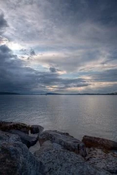 Big rainy clouds passing over an fisherman Stock Photos