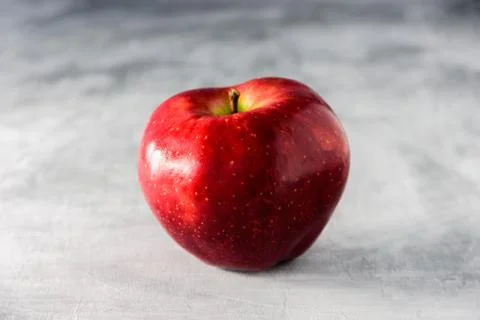 Big red apple on grey background Stock Photos