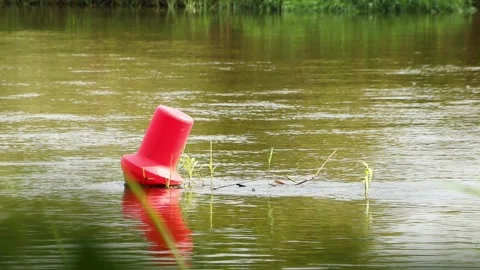 Big Red Buoy Floating on Flowing River Water V.2 Stock Footage 317446552