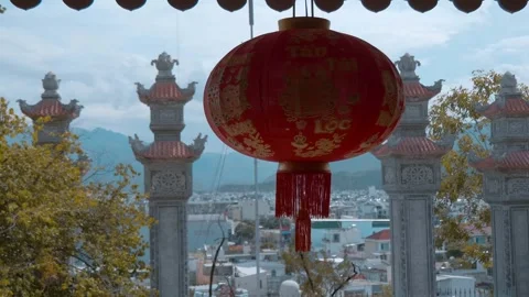 A big red Chinese silk lantern sway on the wind Stock Footage 340628387