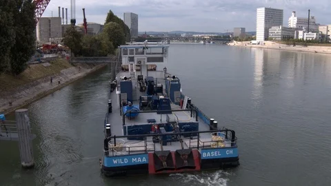 A big red crane preparing an old ship for repairs at the shipyard Stock Footage 120986696