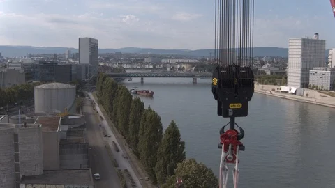 A big red crane preparing an old ship for repairs at the shipyard Stock Footage 120987128