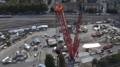 A big red crane preparing an old ship for repairs at the shipyard Video stock 120987712