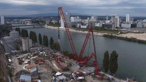 A big red crane preparing an old ship for repairs at the shipyard Stock Footage 120993751