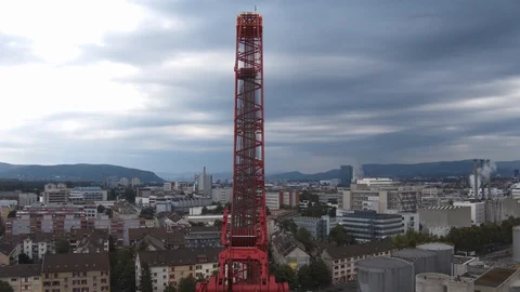 A big red crane preparing an old ship for repairs at the shipyard Stock Footage 120994182
