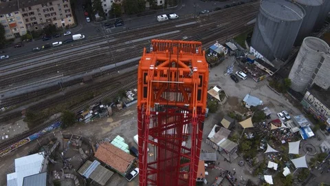 A big red crane preparing an old ship for repairs at the shipyard Stock Footage 120994218