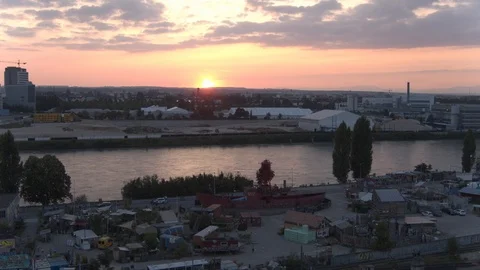 A big red crane preparing an old ship for repairs at the shipyard Stock Footage 120994761