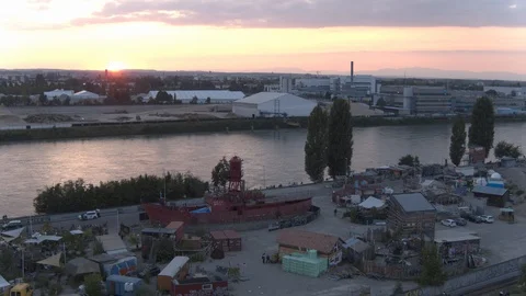 A big red crane preparing an old ship for repairs at the shipyard Stock Footage 120994842
