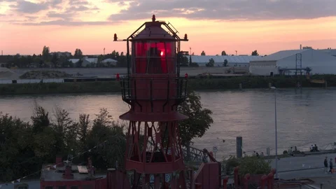A big red crane preparing an old ship for repairs at the shipyard Video stock 120994899