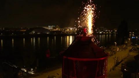 A big red crane preparing an old ship for repairs at the shipyard Stock Footage 120996491