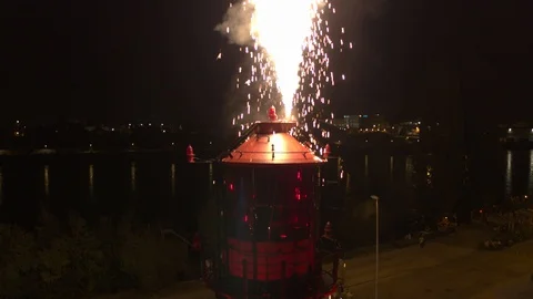 A big red crane preparing an old ship for repairs at the shipyard Stock Footage 120996576