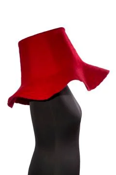 Big red hat made of wool on a mannequin on a white background Foto stock