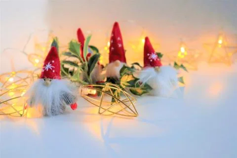 Big red hat on white background with Holly bush with red berries. Fotos Stock