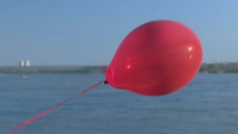 Big red hot air balloon flies against the blue sky 스톡 동영상 154362080