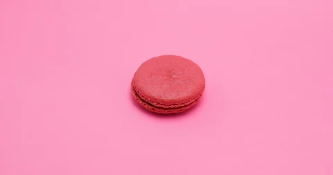 Big red macaroon on pick background Stock-Footage 102777205