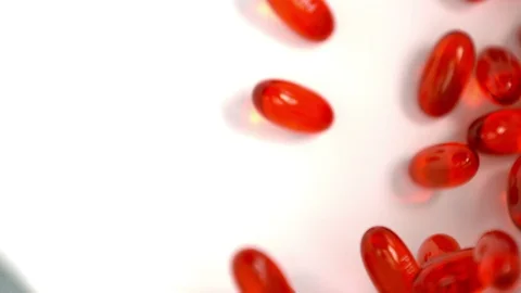 Big red pills slow motion Stock Footage 89207509