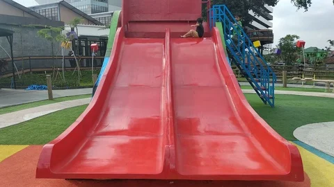 A Big Red Sliding Board Stock Footage 125192361