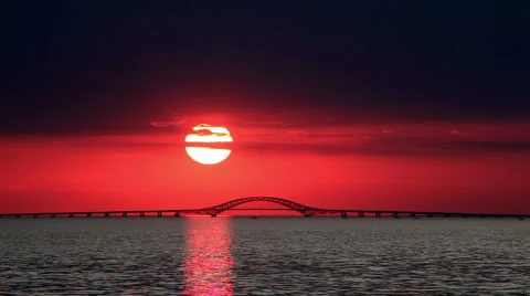 Big Red Sun Setting Over Bridge Stock Footage 924143