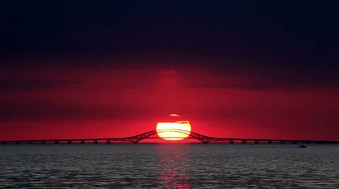 Big Red Sun Setting Over Bridge - Time Lapse Stock Footage 924165