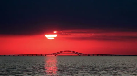 Big Red Sun Setting Over Bridge Stock Footage 44019878