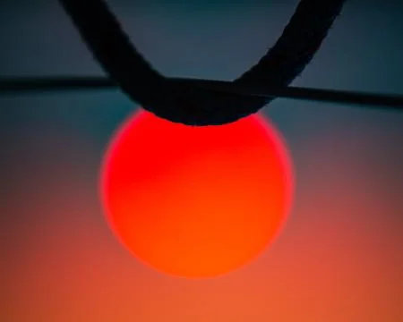 Big red sun under sailing ropes and lifeline silhouette Stock Photos