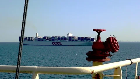 Big red valve connected to long yellow rusty pipe close view Stock Footage 113093605