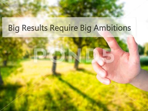 Big Results Require Big Ambitions - Hand pressing a button on bl Stock Photos