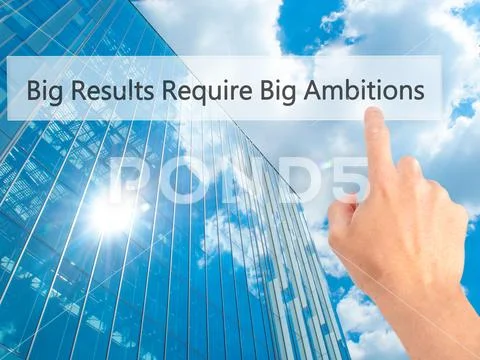 Big Results Require Big Ambitions - Hand pressing a button on bl Stock Photos