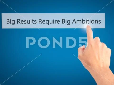 Big Results Require Big Ambitions - Hand pressing a button on bl Stock Photos