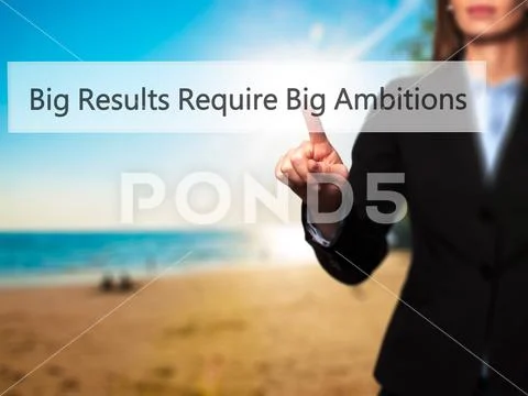 Big Results Require Big Ambitions - Businesswoman pressing high Stock Photos