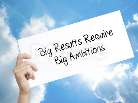 Big Results Require Big Ambitions Sign on white paper. Man Hand Stock Photos
