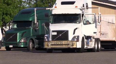 Big rig semi trucks, interstate 5, driver climbing up Stock Footage 37389802