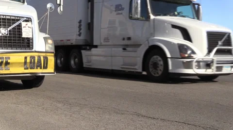 Big rig semi trucks, interstate 5 , wide load White side truck pulling out  Stock Footage 37389913