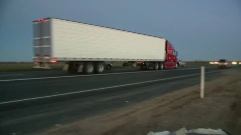 Big Rig Semi Trucks at Speed on Interstate 5 hauling cargo w/ Sound HD 1080 Stock Footage 21766134