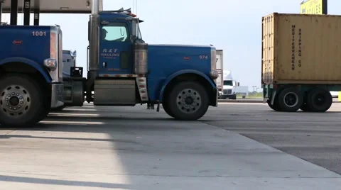 Big Rig (Tractor/Trailer) Pulls out from Truck Stop Stock Footage 54801335