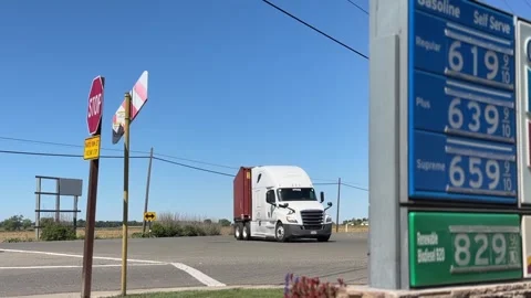 BIG RIG TRUCKER PASSES $8 DOLLAR GAS PRICES CALIFORNIA HIGH FUEL DIESEL Stock-Footage 332258002