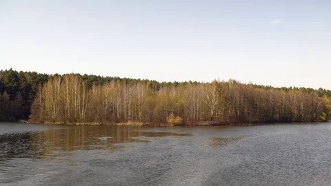 Big river, against the background of trees with sky. Spring. Stock Footage 107734159