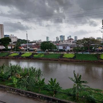 Big river on the edge of the settlement Stock Photos